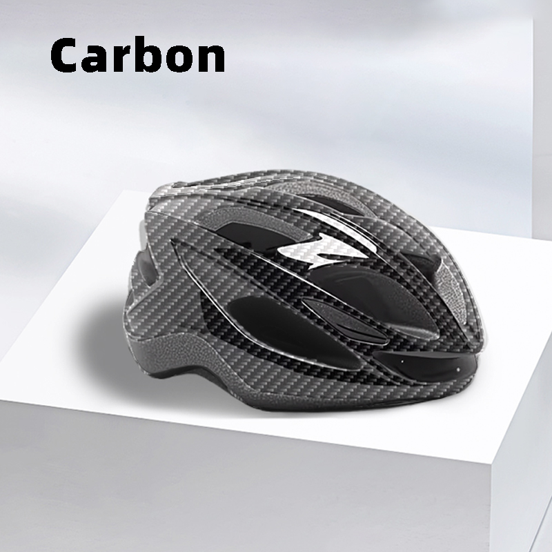 Carbon fiber style bicycle helmet with aerodynamic vents displayed on a white platform.